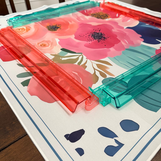 Christmas Mahjong racks and pushers on a floral and abstract patterned mat